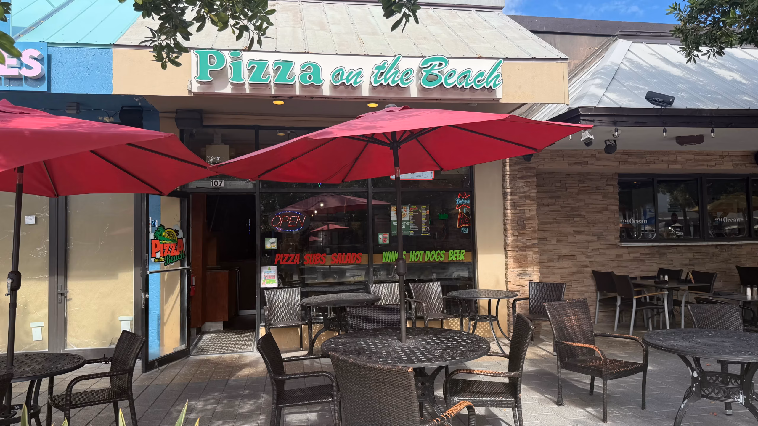 Streetfront view of Pizza On The Beach with its outdoor seating in Lauderdale-by-the-Sea